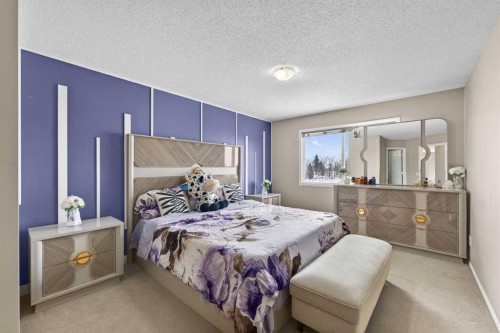 106 Saddlecrest Crescent Ne, Calgary, AB - Indoor Photo Showing Bedroom