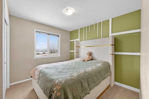 106 Saddlecrest Crescent Ne, Calgary, AB - Indoor Photo Showing Bedroom