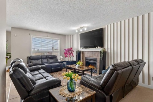 106 Saddlecrest Crescent Ne, Calgary, AB - Indoor Photo Showing Living Room With Fireplace