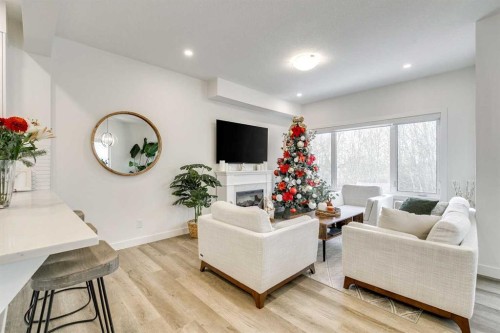 156 Crestridge Common Sw, Calgary, AB - Indoor Photo Showing Living Room With Fireplace