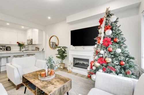 156 Crestridge Common Sw, Calgary, AB - Indoor Photo Showing Other Room With Fireplace