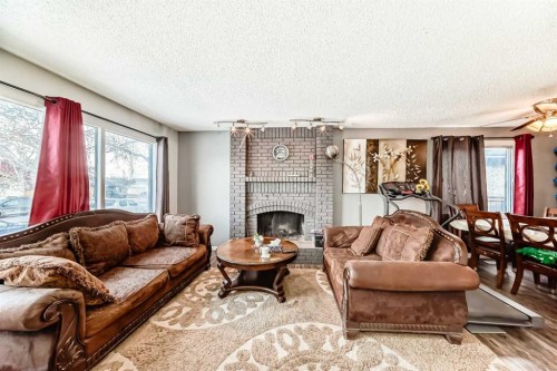 6944 Temple Drive Ne, Calgary, AB - Indoor Photo Showing Living Room With Fireplace