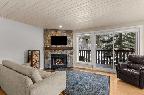 1-1061 Evergreen Circle, Canmore, AB - Indoor Photo Showing Living Room With Fireplace