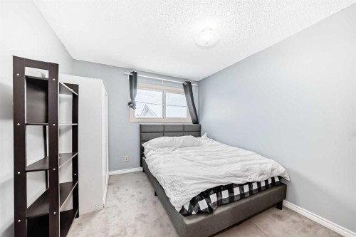 791 Penbrooke Road Se, Calgary, AB - Indoor Photo Showing Bedroom