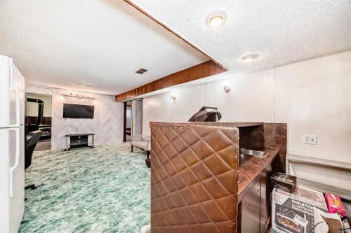 791 Penbrooke Road Se, Calgary, AB - Indoor With Fireplace