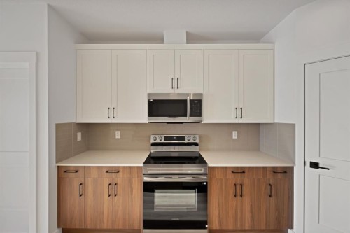 7322-1802 Mahagony Boulevard Se, Calgary, AB - Indoor Photo Showing Kitchen
