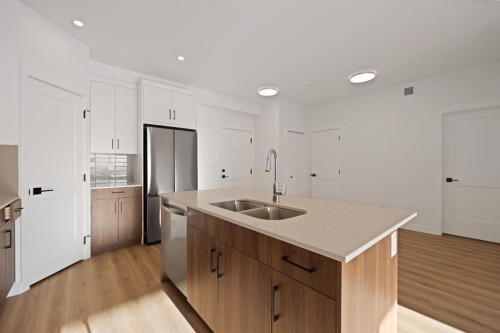 7322-1802 Mahagony Boulevard Se, Calgary, AB - Indoor Photo Showing Kitchen With Double Sink