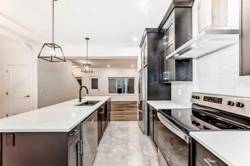 1449 Bayview Point Sw, Airdrie, AB - Indoor Photo Showing Kitchen With Upgraded Kitchen
