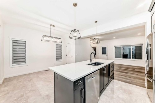 1449 Bayview Point Sw, Airdrie, AB - Indoor Photo Showing Kitchen With Double Sink