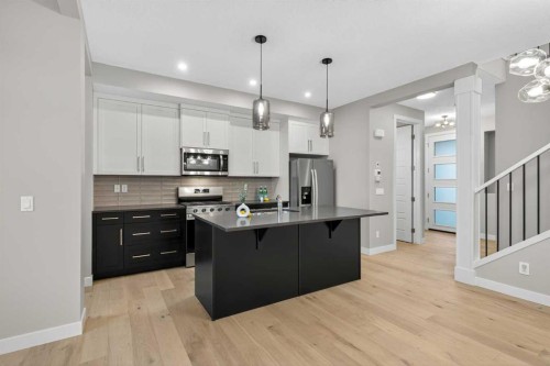 37 Southborough Lane, Cochrane, AB - Indoor Photo Showing Kitchen With Upgraded Kitchen
