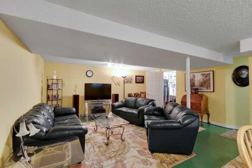 2623 Glencastle Street Sw, Calgary, AB - Indoor Photo Showing Living Room