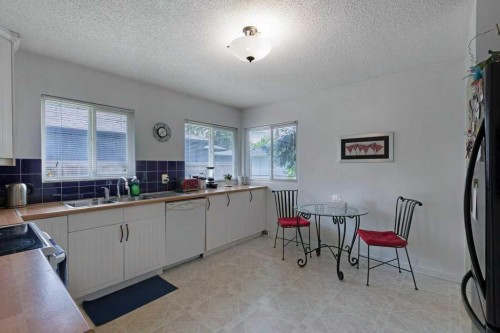 2623 Glencastle Street Sw, Calgary, AB - Indoor Photo Showing Kitchen With Double Sink