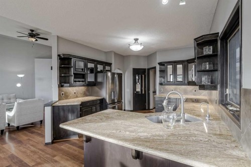 60 Mckenzie Lake Crescent Se, Calgary, AB - Indoor Photo Showing Kitchen With Double Sink With Upgraded Kitchen