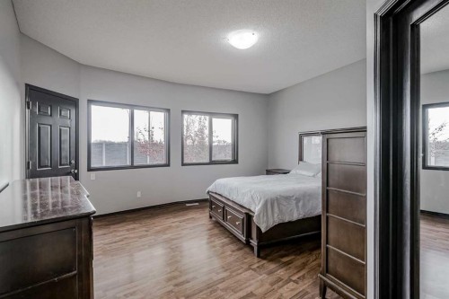 60 Mckenzie Lake Crescent Se, Calgary, AB - Indoor Photo Showing Bedroom
