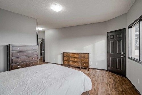 60 Mckenzie Lake Crescent Se, Calgary, AB - Indoor Photo Showing Bedroom