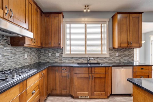 461 Discovery Ridge Boulevard Sw, Calgary, AB - Indoor Photo Showing Kitchen With Double Sink