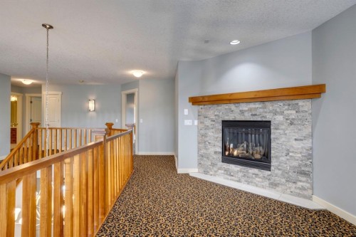 461 Discovery Ridge Boulevard Sw, Calgary, AB - Indoor With Fireplace