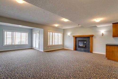 461 Discovery Ridge Boulevard Sw, Calgary, AB - Indoor With Fireplace