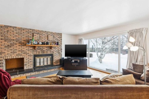 149 Wildwood Drive Sw, Calgary, AB - Indoor Photo Showing Living Room With Fireplace