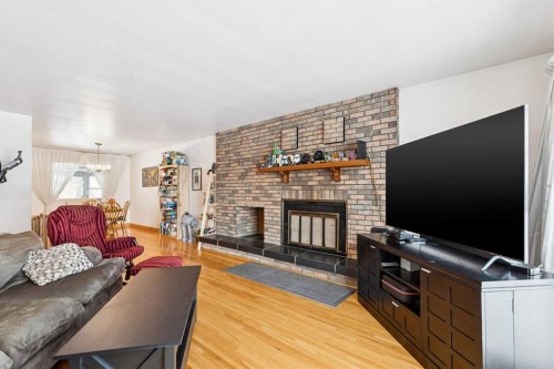 149 Wildwood Drive Sw, Calgary, AB - Indoor Photo Showing Living Room With Fireplace