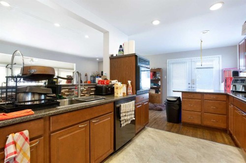 6003 Baroc Road Nw, Calgary, AB - Indoor Photo Showing Kitchen With Double Sink