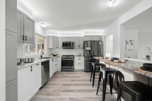 3251 Bearspaw Drive Nw, Calgary, AB - Indoor Photo Showing Kitchen With Stainless Steel Kitchen With Upgraded Kitchen