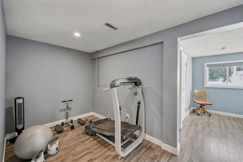 106 Eldorado Road Se, Airdrie, AB - Indoor Photo Showing Gym Room