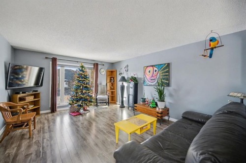 106 Eldorado Road Se, Airdrie, AB - Indoor Photo Showing Living Room
