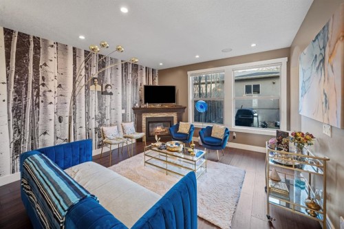 4410 17 Avenue Nw, Calgary, AB - Indoor Photo Showing Living Room With Fireplace