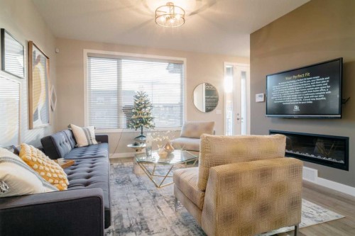 237 Cobblestone Gate Sw, Airdrie, AB - Indoor Photo Showing Living Room With Fireplace
