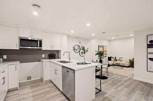 239 Creekstone Circle Sw, Calgary, AB - Indoor Photo Showing Kitchen With Double Sink With Upgraded Kitchen