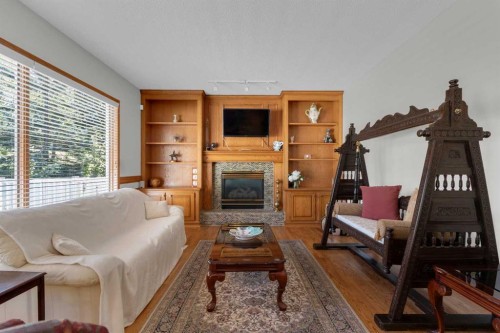 271 Mountain Park Drive Se, Calgary, AB - Indoor Photo Showing Living Room With Fireplace