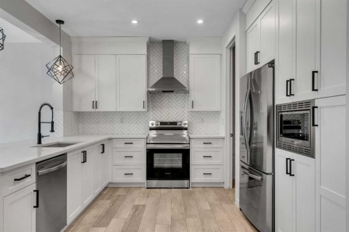 20 Rowley Common Nw, Calgary, AB - Indoor Photo Showing Kitchen With Stainless Steel Kitchen With Upgraded Kitchen