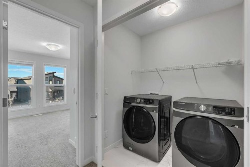 20 Rowley Common Nw, Calgary, AB - Indoor Photo Showing Laundry Room