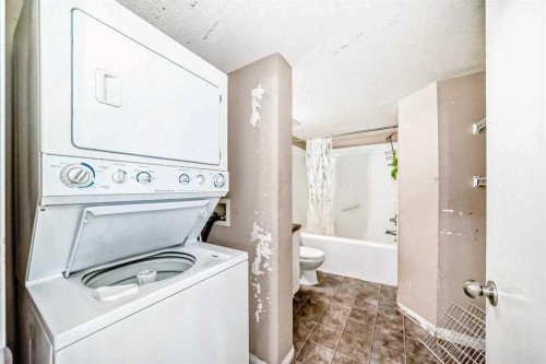 411-2000 Applevillage Court Se, Calgary, AB - Indoor Photo Showing Laundry Room