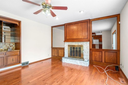 40 Edforth Road Nw, Calgary, AB - Indoor Photo Showing Living Room With Fireplace
