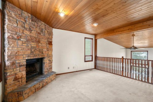 40 Edforth Road Nw, Calgary, AB - Indoor With Fireplace