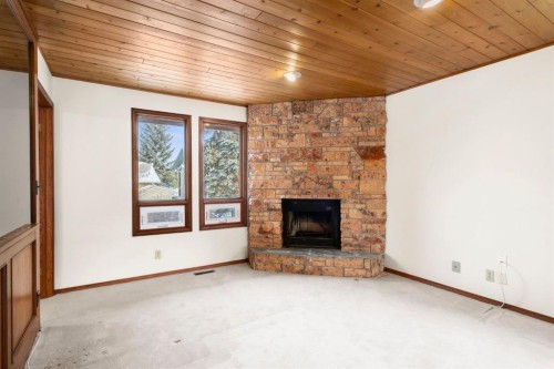40 Edforth Road Nw, Calgary, AB - Indoor Photo Showing Living Room With Fireplace
