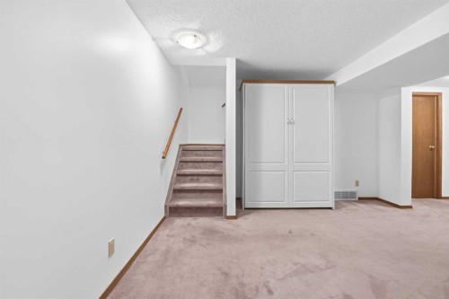 12 Arbour Cliff Close Nw, Calgary, AB - Indoor Photo Showing Other Room