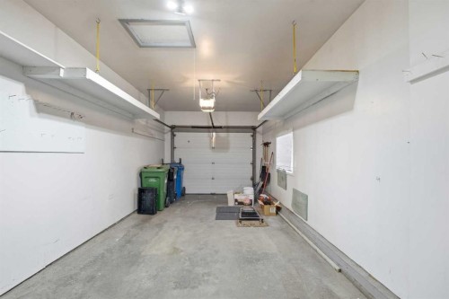 12 Arbour Cliff Close Nw, Calgary, AB - Indoor Photo Showing Garage