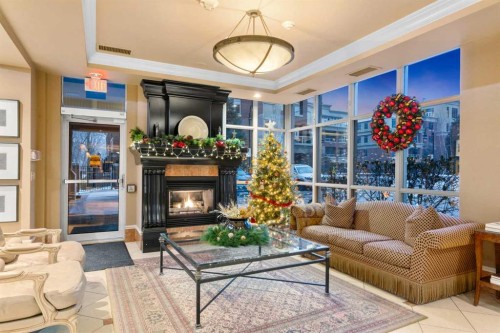804-690 Princeton Way Sw, Calgary, AB - Indoor Photo Showing Living Room With Fireplace