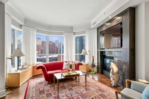804-690 Princeton Way Sw, Calgary, AB - Indoor Photo Showing Living Room With Fireplace