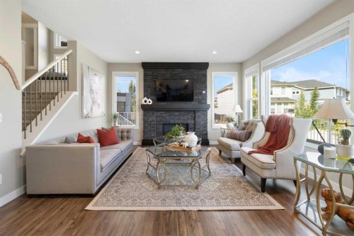 33 Silverado Crest Bay Sw, Calgary, AB - Indoor Photo Showing Living Room With Fireplace