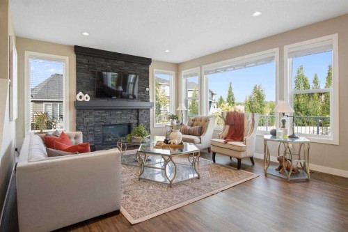 33 Silverado Crest Bay Sw, Calgary, AB - Indoor Photo Showing Living Room With Fireplace
