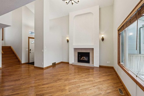 837 Applewood Drive Se, Calgary, AB - Indoor Photo Showing Other Room With Fireplace