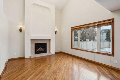 837 Applewood Drive Se, Calgary, AB - Indoor Photo Showing Living Room With Fireplace