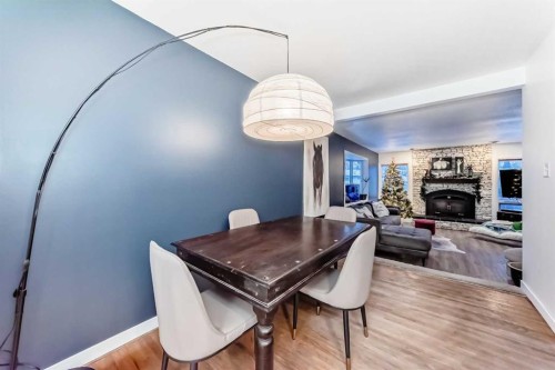 107 Fawn Crescent Se, Calgary, AB - Indoor Photo Showing Dining Room With Fireplace
