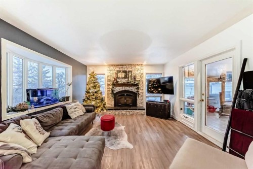 107 Fawn Crescent Se, Calgary, AB - Indoor Photo Showing Living Room With Fireplace