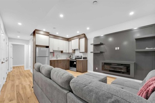 216 99 Avenue Se, Calgary, AB - Indoor Photo Showing Living Room With Fireplace