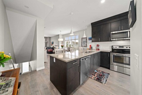 512 Drake Landing Wynd, Okotoks, AB - Indoor Photo Showing Kitchen With Stainless Steel Kitchen With Upgraded Kitchen